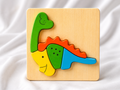 Wooden embossed dinosaur puzzle – handcrafted 3D educational toy for kids by Jumbo Maama